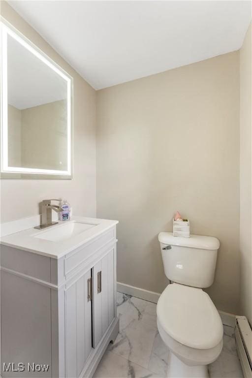 2615 Daffodil St NE, Canton, OH 44705 - half bathroom with marble finish floors, a baseboard heating unit, and vanity