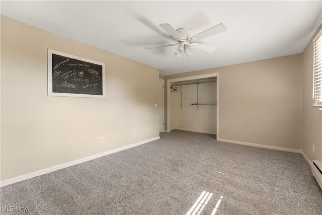 2615 Daffodil St NE, Canton, OH 44705 - unfurnished bedroom featuring carpet flooring, a closet, ceiling fan, and baseboard heating