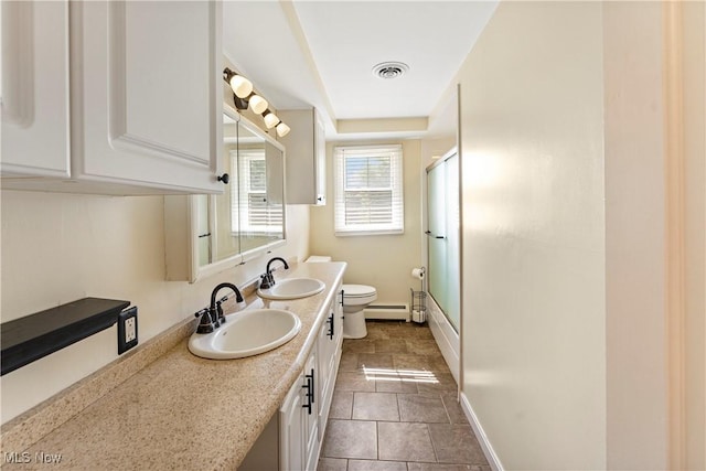 2615 Daffodil St NE, Canton, OH 44705 - full bath with double vanity and a baseboard radiator