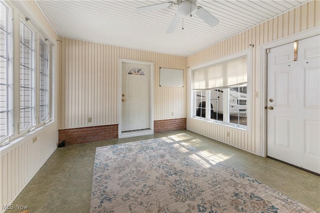 2615 Daffodil St NE, Canton, OH 44705 - unfurnished sunroom with a ceiling fan