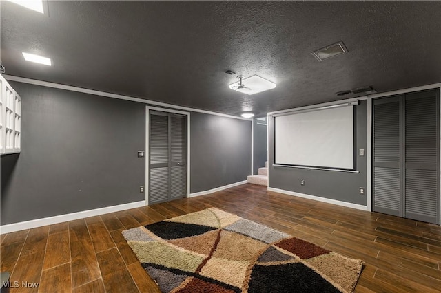 2615 Daffodil St NE, Canton, OH 44705 - cinema room with wood finished floors, a textured ceiling, and ornamental molding