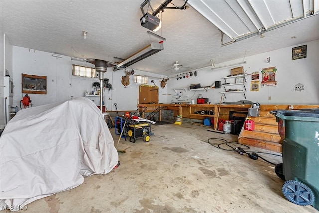 2615 Daffodil St NE, Canton, OH 44705 - garage featuring a workshop area, a garage door opener, and ceiling fan