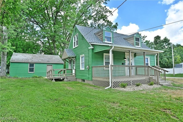 1006 Trumbull Ave, Warren, OH 44420 - view of front of house featuring a porch, a front yard, and roof with shingles