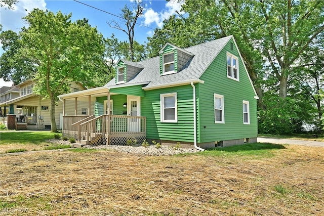 1006 Trumbull Ave, Warren, OH 44420 - view of front of house featuring a porch and roof with shingles