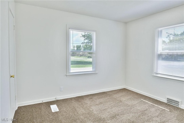 1006 Trumbull Ave, Warren, OH 44420 - carpeted spare room featuring baseboards