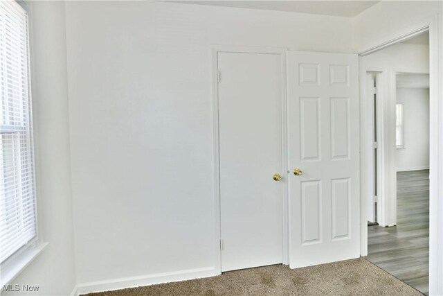 1006 Trumbull Ave, Warren, OH 44420 - unfurnished bedroom featuring carpet floors and baseboards