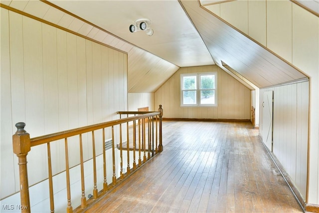 1006 Trumbull Ave, Warren, OH 44420 - additional living space with hardwood / wood-style floors, lofted ceiling, and wood walls