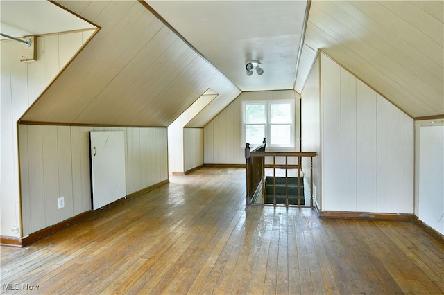 1006 Trumbull Ave, Warren, OH 44420 - additional living space with hardwood / wood-style flooring, lofted ceiling, and wooden walls