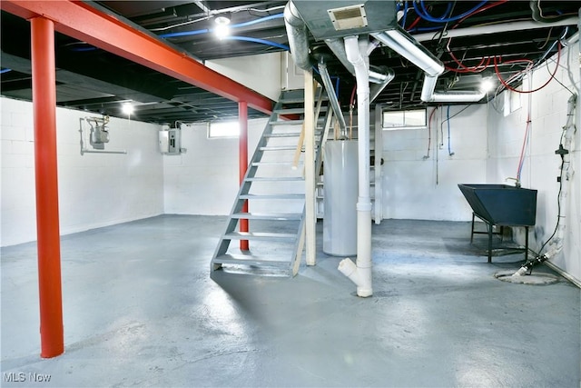 1006 Trumbull Ave, Warren, OH 44420 - basement with water heater, electric panel, healthy amount of natural light, and stairs