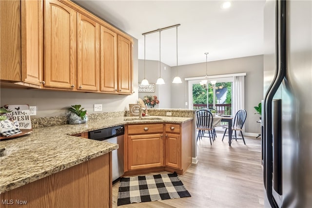 2395 Tremont Ave, Cleveland, OH 44113 - kitchen with stainless steel appliances, a peninsula, light wood-style flooring, and light stone countertops