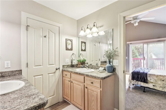 2395 Tremont Ave, Cleveland, OH 44113 - bathroom with two vanities, ensuite bathroom, ceiling fan, and vaulted ceiling