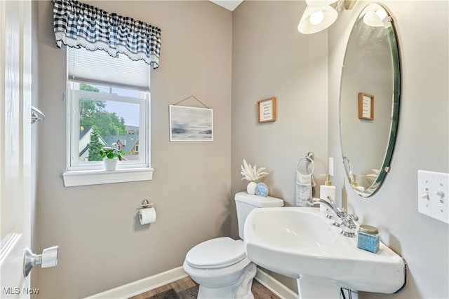 2395 Tremont Ave, Cleveland, OH 44113 - bathroom with toilet and wood finished floors