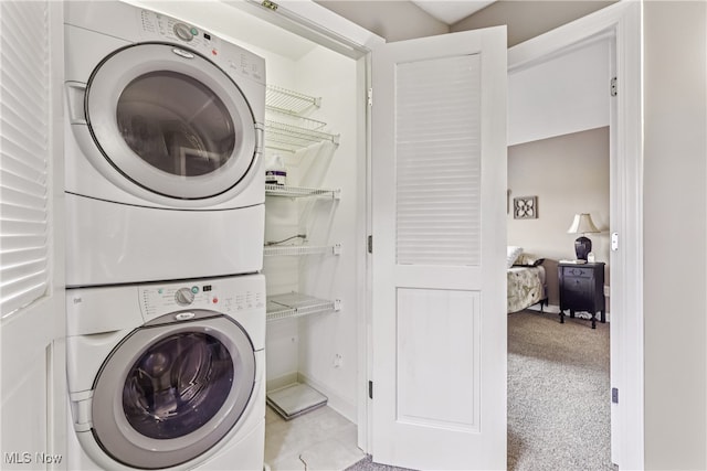 2395 Tremont Ave, Cleveland, OH 44113 - laundry area with estacked washer and dryer and baseboards