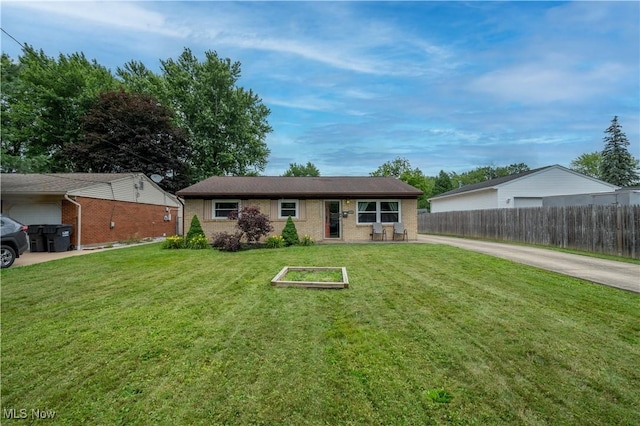 1291 Woodhurst Dr, Austintown, OH 44515 - ranch-style home with brick siding and a garden