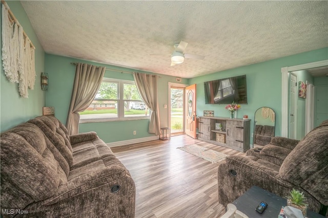 1291 Woodhurst Dr, Austintown, OH 44515 - living area with a textured ceiling, wood finished floors, and a ceiling fan