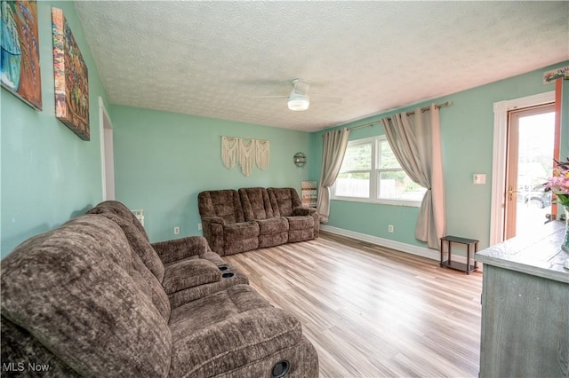 1291 Woodhurst Dr, Austintown, OH 44515 - living room featuring a textured ceiling, wood finished floors, and ceiling fan