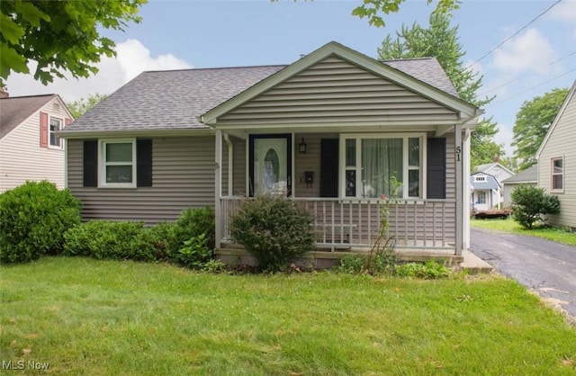 51 N Navarre Ave, Youngstown, OH 44515 - view of front facade with covered porch, a front lawn, and a shingled roof