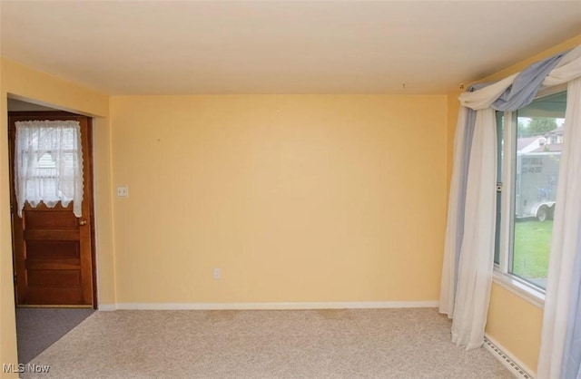 51 N Navarre Ave, Youngstown, OH 44515 - spare room featuring light carpet and a baseboard heating unit