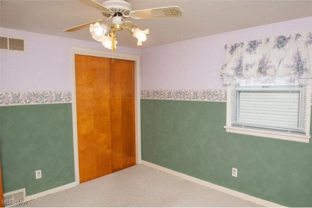 51 N Navarre Ave, Youngstown, OH 44515 - unfurnished bedroom featuring carpet floors, a closet, and a ceiling fan