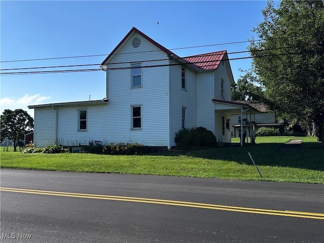 468 Carl St, Cumberland, OH 43732 - view of property exterior featuring a yard