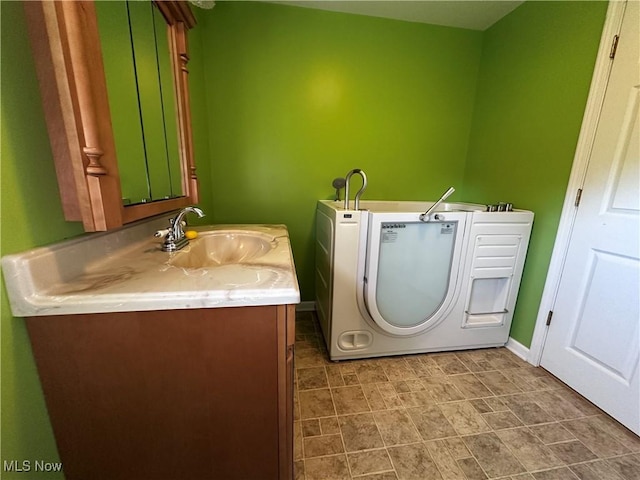 468 Carl St, Cumberland, OH 43732 - laundry area with a sink and washer / clothes dryer