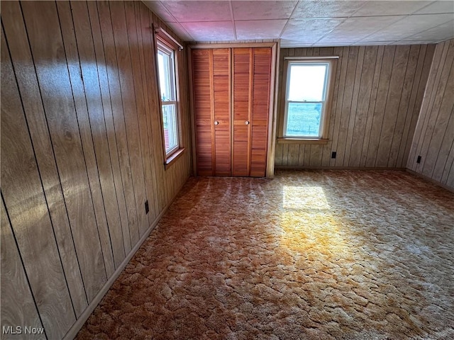 468 Carl St, Cumberland, OH 43732 - unfurnished bedroom featuring wooden walls