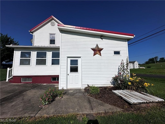 468 Carl St, Cumberland, OH 43732 - view of front of home featuring a patio and a metal roof