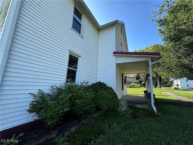468 Carl St, Cumberland, OH 43732 - view of home's exterior with a lawn