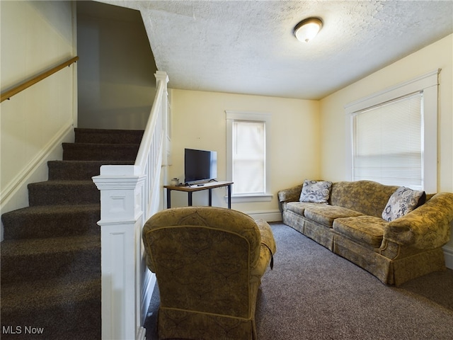 237 E Thornton St, Akron, OH 44311 - living room with a textured ceiling, carpet floors, healthy amount of natural light, and stairs