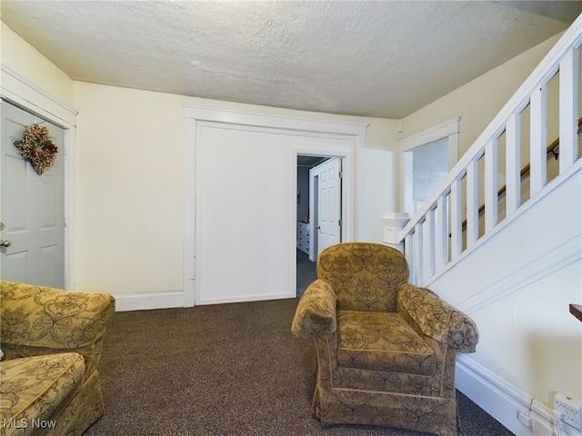 237 E Thornton St, Akron, OH 44311 - sitting room with carpet floors, a textured ceiling, and stairs