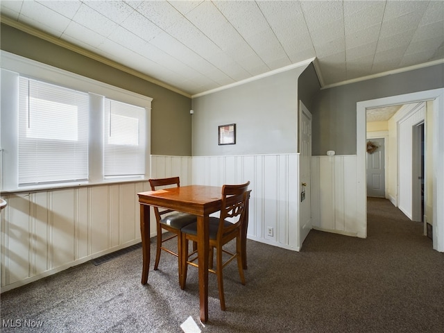 237 E Thornton St, Akron, OH 44311 - dining area with ornamental molding, carpet, and wainscoting