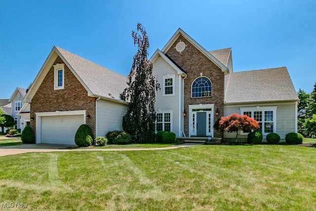415 Cascade Ct, Avon Lake, OH 44012 - traditional-style house featuring brick siding, concrete driveway, and a front yard