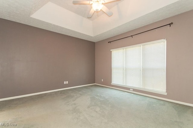 415 Cascade Ct, Avon Lake, OH 44012 - carpeted spare room featuring a ceiling fan and a raised ceiling