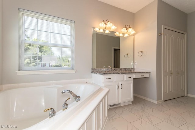 415 Cascade Ct, Avon Lake, OH 44012 - full bathroom with marble look tiles, vanity, and a bath