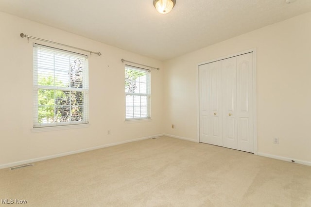 415 Cascade Ct, Avon Lake, OH 44012 - unfurnished bedroom featuring light carpet and a closet