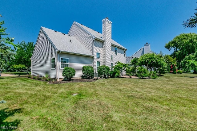 415 Cascade Ct, Avon Lake, OH 44012 - rear view of house featuring a yard and a chimney