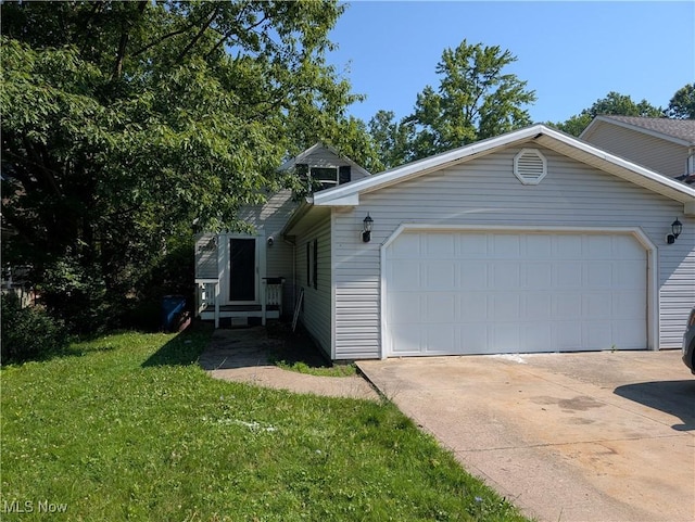 36843 Stevens Blvd, Willoughby, OH 44094 - view of front of house featuring a garage, concrete driveway, and a front lawn
