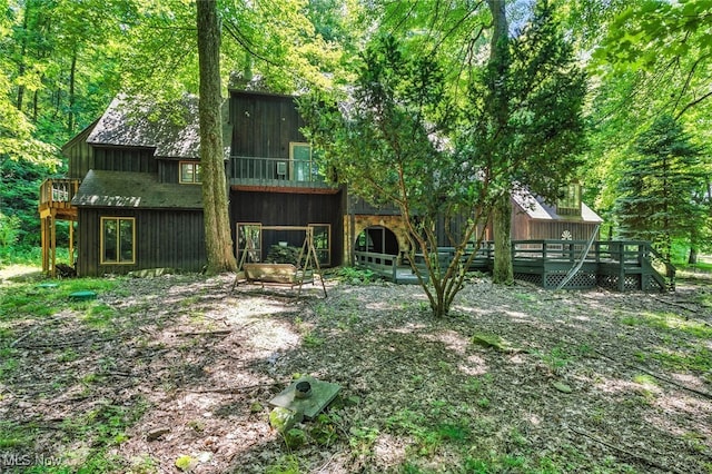 1915 Claus Rd, Vermilion, OH 44089 - back of property featuring a wooden deck and a forest view