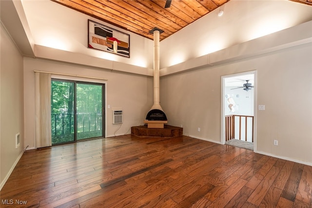 1915 Claus Rd, Vermilion, OH 44089 - unfurnished living room featuring hardwood / wood-style floors, wood ceiling, a wood stove, high vaulted ceiling, and a wall mounted AC