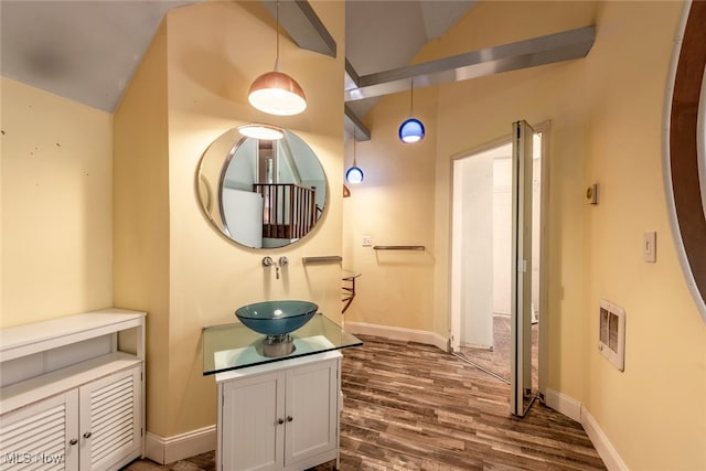 1915 Claus Rd, Vermilion, OH 44089 - hall featuring vaulted ceiling, dark wood-style floors, and heating unit
