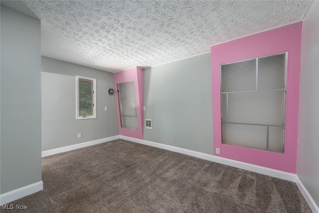 1915 Claus Rd, Vermilion, OH 44089 - carpeted spare room featuring a textured ceiling and baseboards