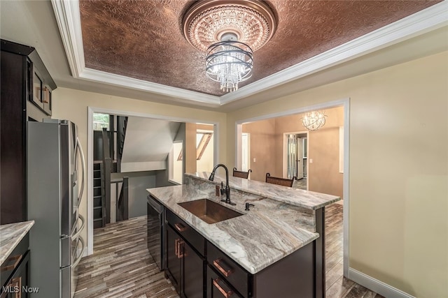 1915 Claus Rd, Vermilion, OH 44089 - kitchen with a chandelier, stainless steel appliances, a raised ceiling, dark wood-type flooring, and ornamental molding