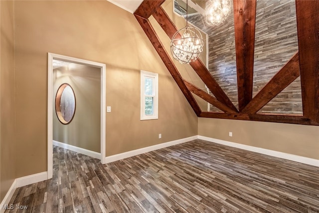 1915 Claus Rd, Vermilion, OH 44089 - additional living space with dark wood finished floors, a chandelier, and lofted ceiling