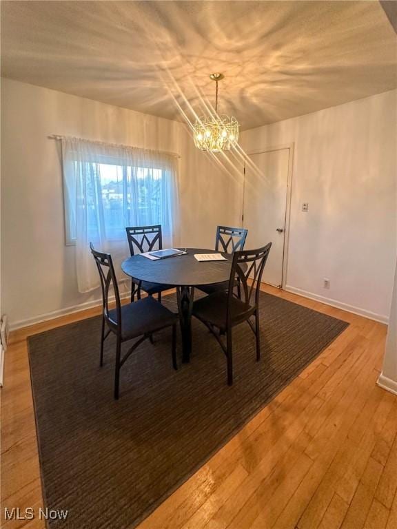 4926 E Wallings Rd, Broadview Heights, OH 44147 - dining area with a chandelier and wood finished floors