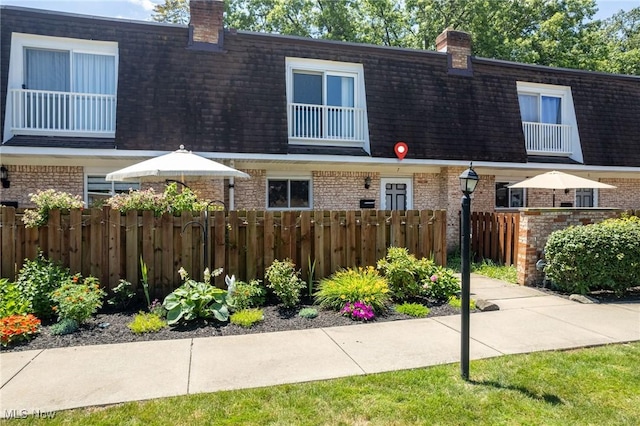 6480 State Rd Unit F7, Parma, OH 44134 - multi unit property featuring mansard roof, brick siding, and a chimney