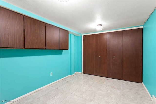 6480 State Rd Unit F7, Parma, OH 44134 - unfurnished bedroom featuring a closet and baseboards