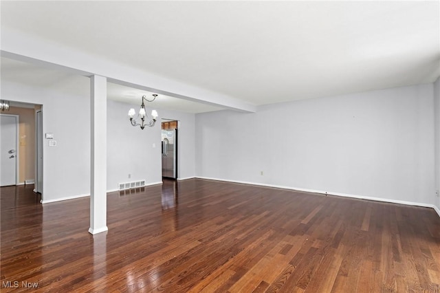 6480 State Rd Unit F7, Parma, OH 44134 - unfurnished living room featuring a chandelier and wood finished floors