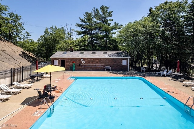6480 State Rd Unit F7, Parma, OH 44134 - community pool featuring a patio area and view of scattered trees