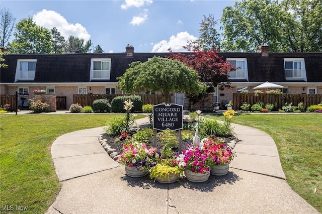 6480 State Rd Unit F7, Parma, OH 44134 - view of property featuring mansard roof, brick siding, and a chimney