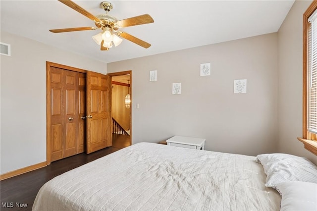 1101 Partridge Dr, Wadsworth, OH 44281 - bedroom with dark wood-type flooring, ceiling fan, and a closet